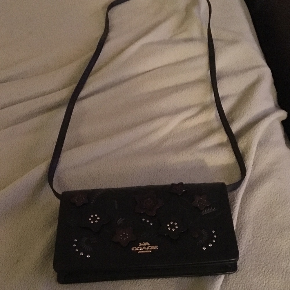 Small Coach crossbody purse.